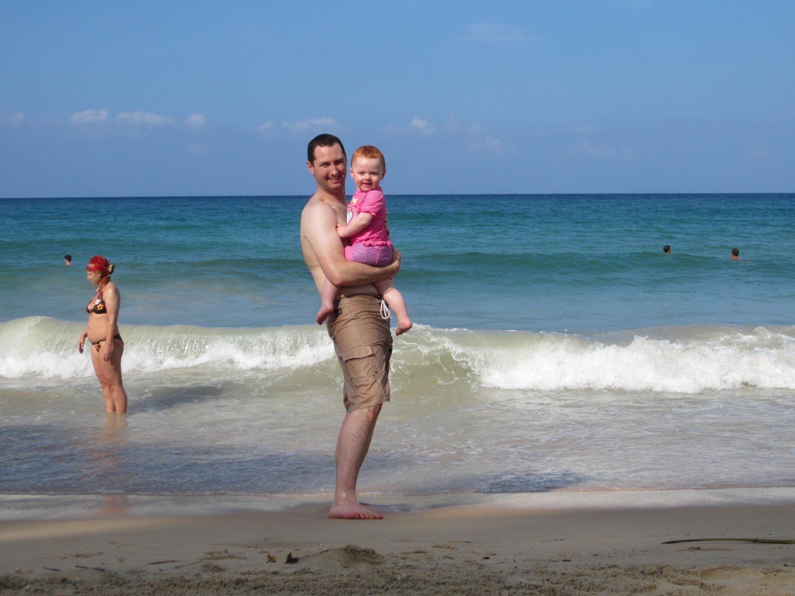 Dad and toddler on the beach at kata phuket