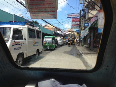 Main road in Boracay from the pedicab, full of cars philippines