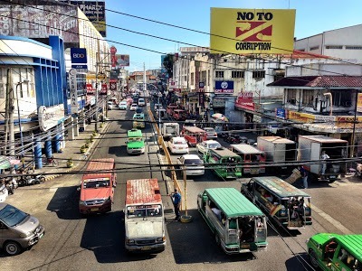 A street in Iloilo City full of jeepneys