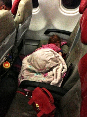 S sleeping across seats on air asia flight to melbourne