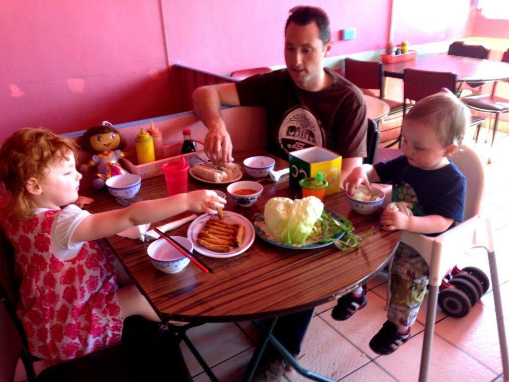 Family sitting with baby and toddler at thy thy vietnamese restaurant in victoria street richmond