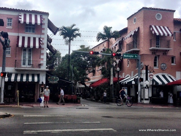 the beautiful, pink buildings at the entrance to Espanola Way, south beach miami