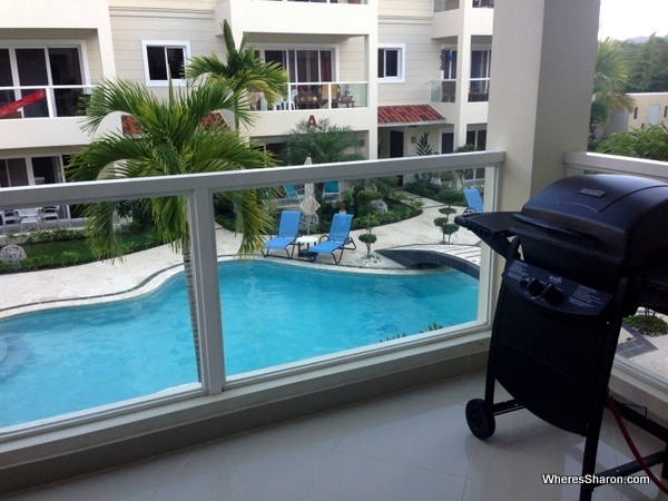 balcony with bbq and pool in the background in vacation rental cabarete