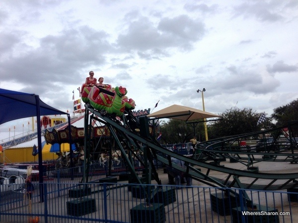 people on small roller coaster