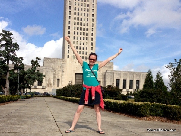 person standing in front of Louisiana State Capitol building