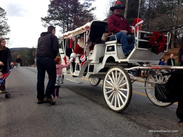 kid meeting santa on main street of Helen GA christmas parade