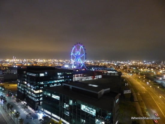 View of Melbourne Star and Melbourne at night 