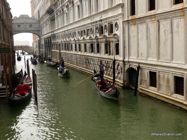Venice's famous Gondolas cruising past the Doge's palace.