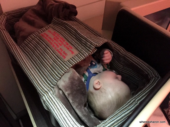 Baby takes a nap in Etihad business class A330